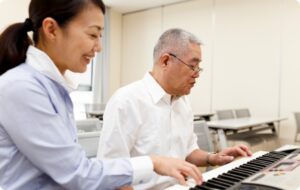 Music therapist with client